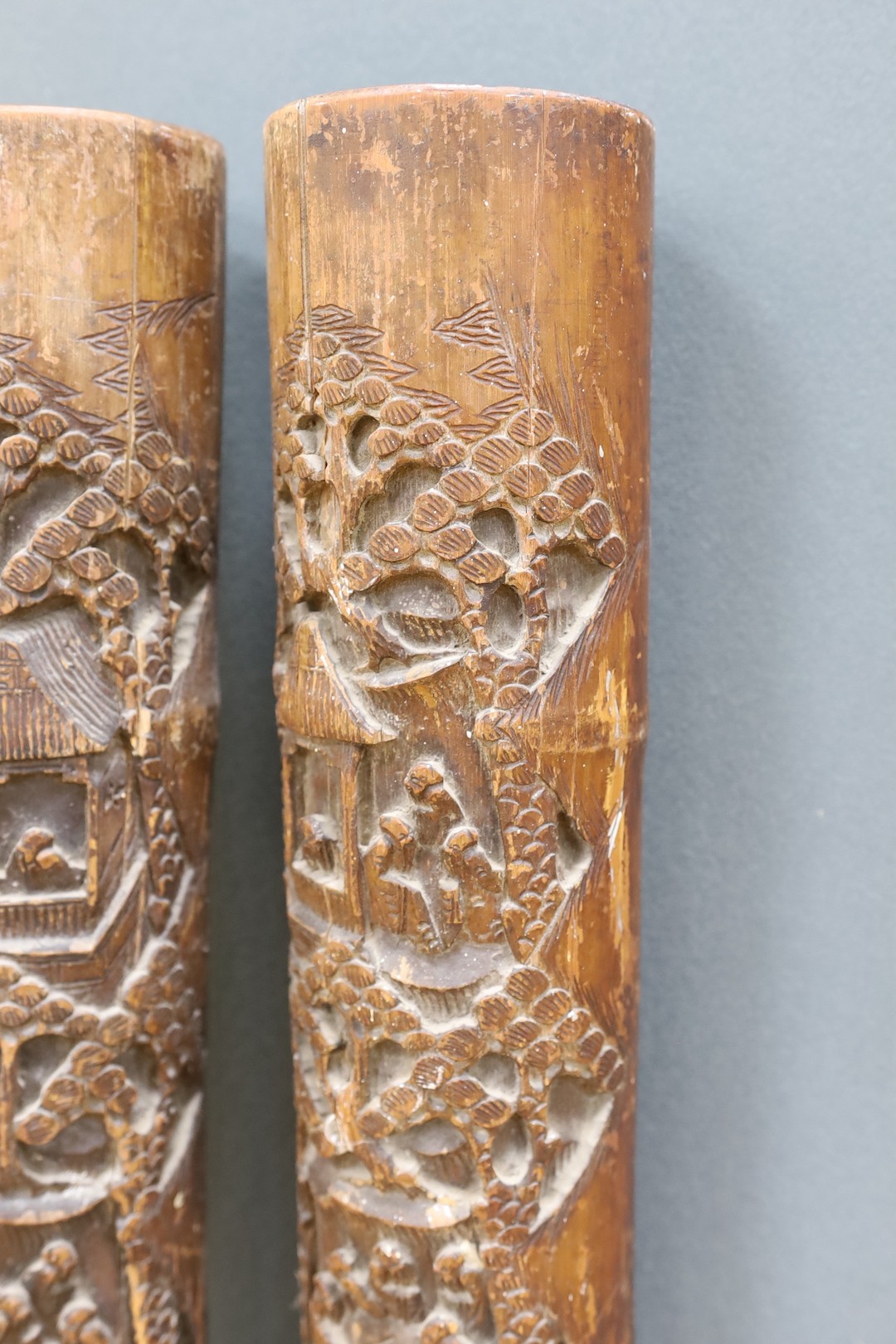 A pair of early 20th century Chinese carved bamboo chutes, 70cm
